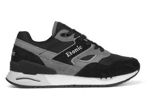 Etonic Stable Base sneakers in black nubuck, tonal mesh fabric, black suede with multi-layer dark grey leather inserts, white midsole and black bottom outsole.