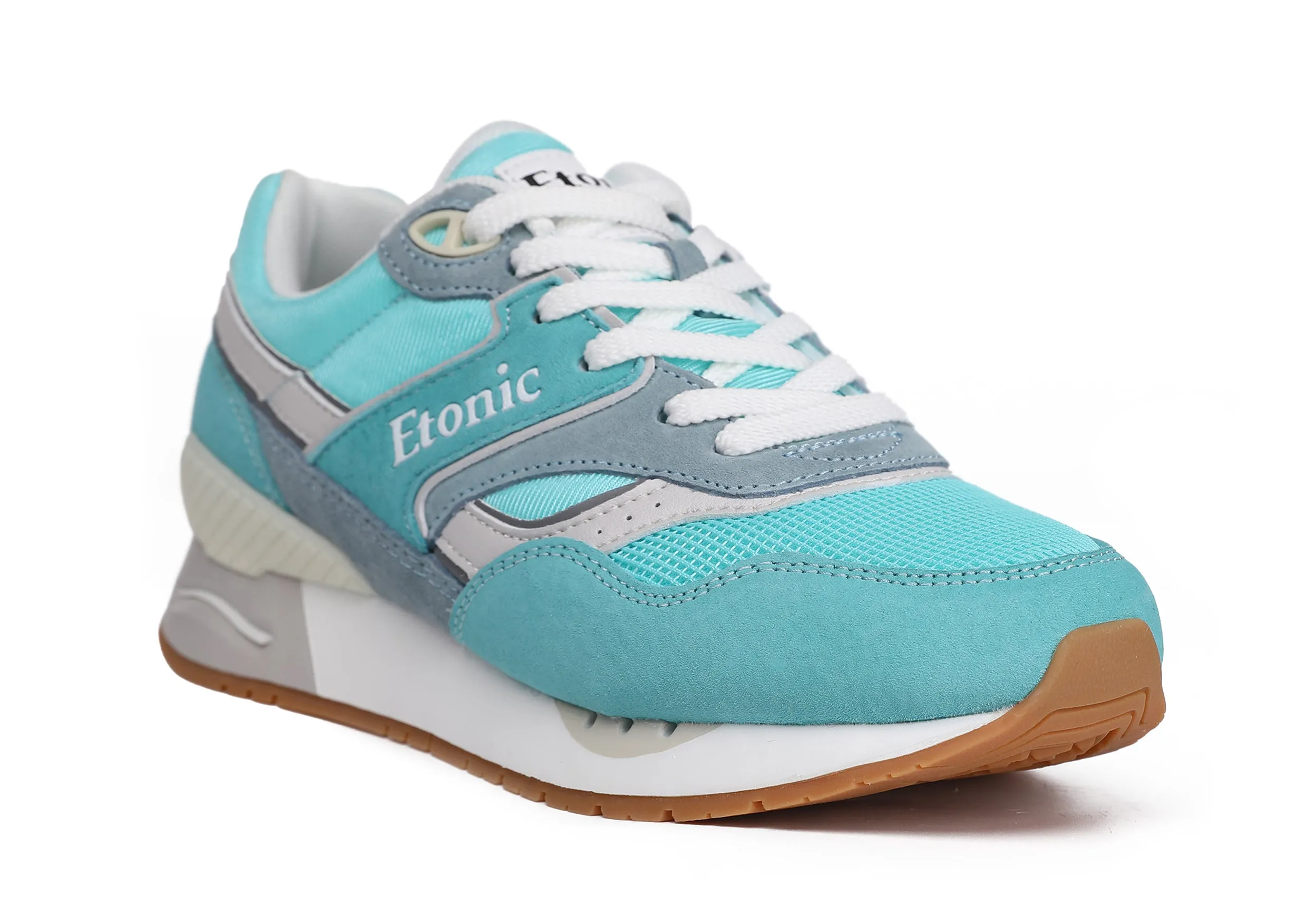 Etonic Stable Base sneakers in turquoise mesh fabric, turquoise suede with multi-layer powder blue leather inserts, off white midsole and light honey bottom outsole.