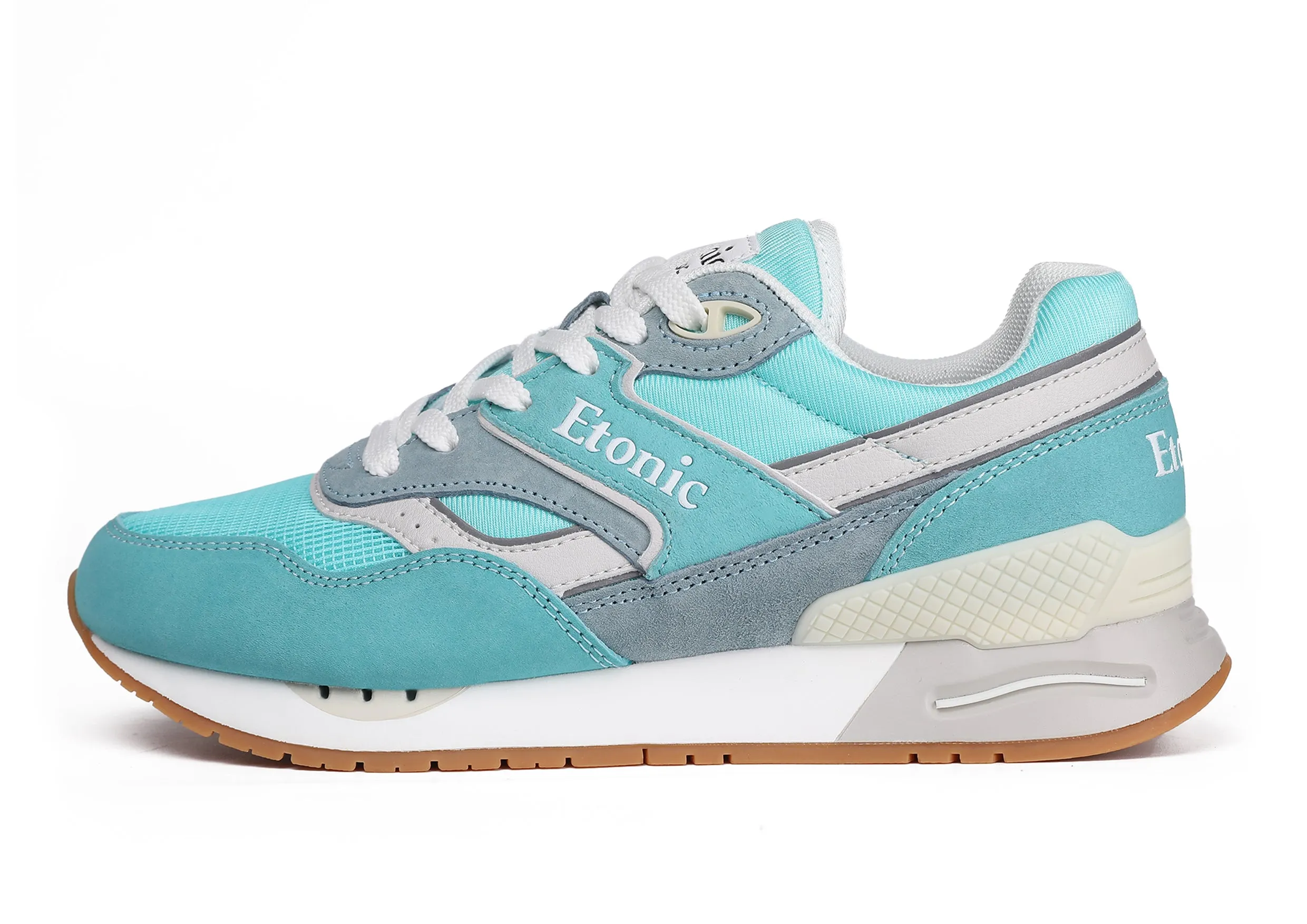 Etonic Stable Base sneakers in turquoise mesh fabric, turquoise suede with multi-layer powder blue leather inserts, off white midsole and light honey bottom outsole.