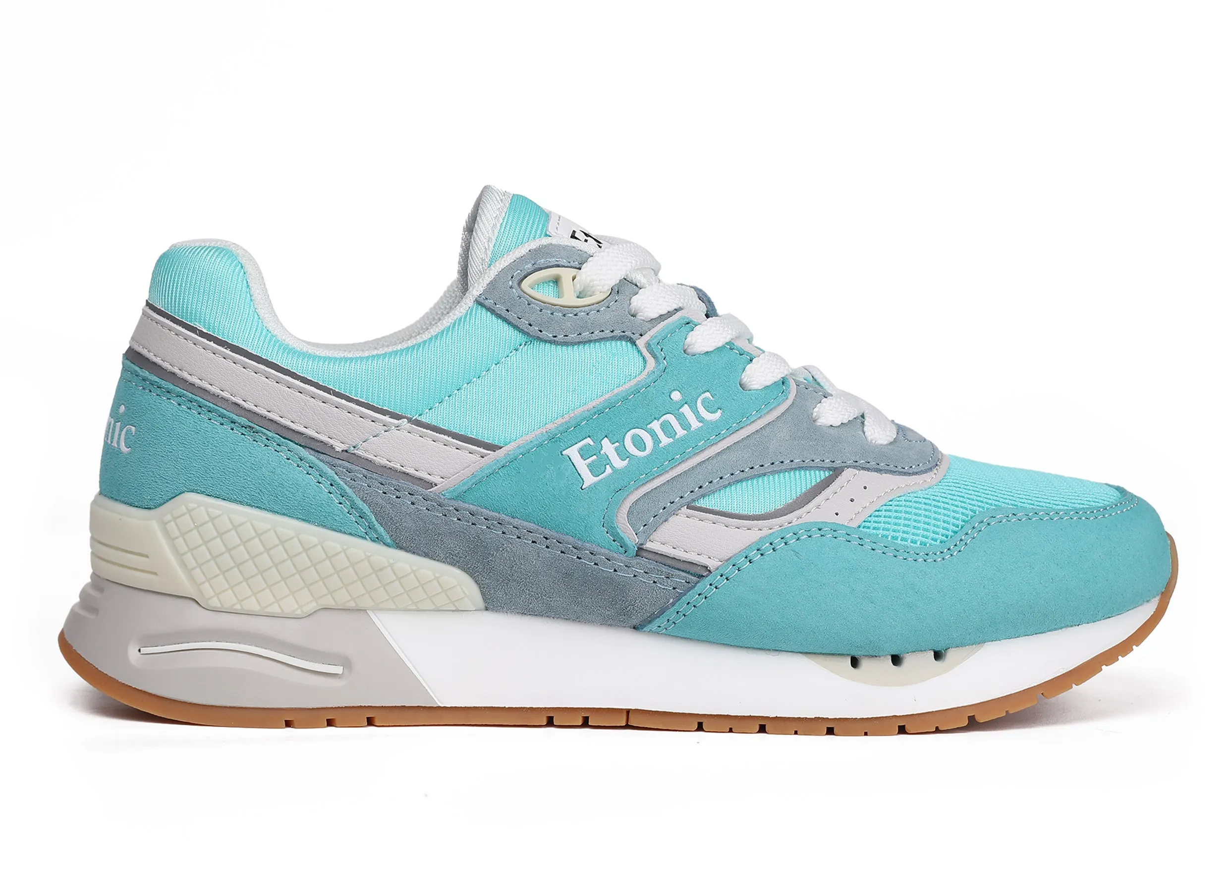 Etonic Stable Base sneakers in turquoise mesh fabric, turquoise suede with multi-layer powder blue leather inserts, off white midsole and light honey bottom outsole.